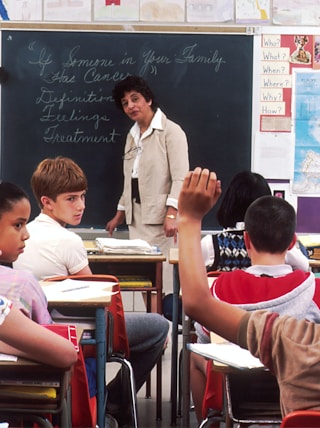 woman standing in front of children