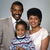 portrait photograph of family of three
