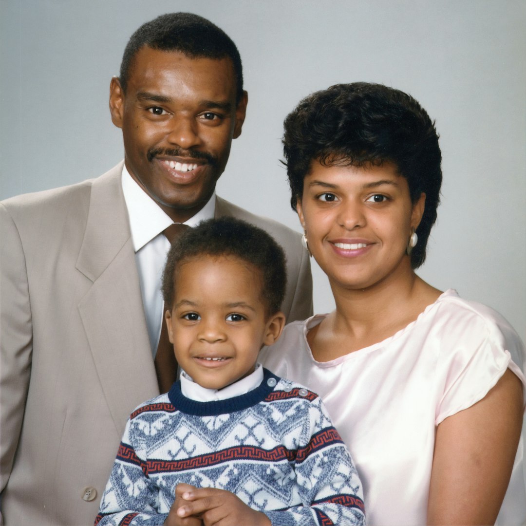 Family Portrait. An African American family, including one man, one woman, and one child. Photographer Bill Branson