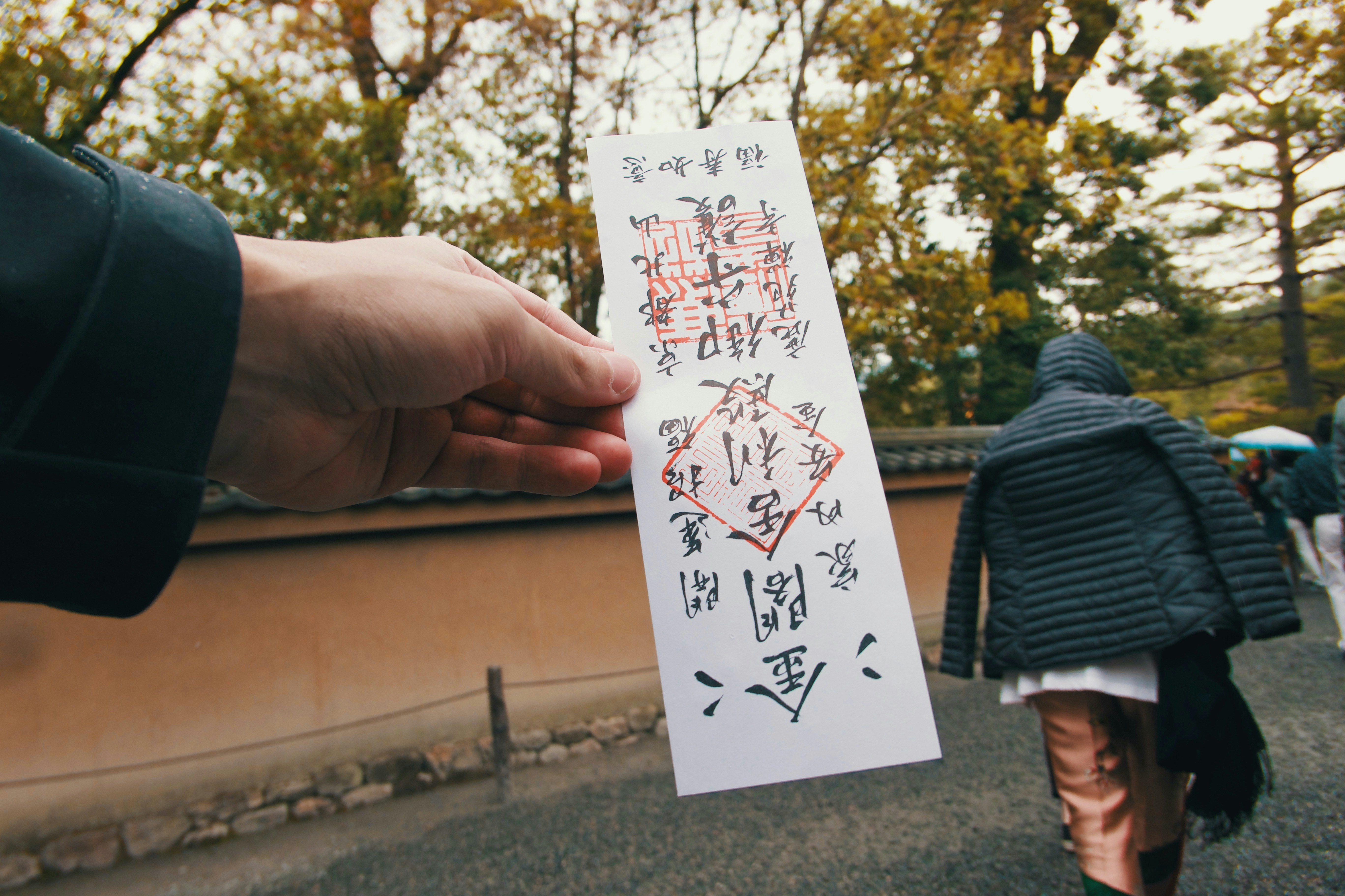 Couple holding sticky notes with loving messages