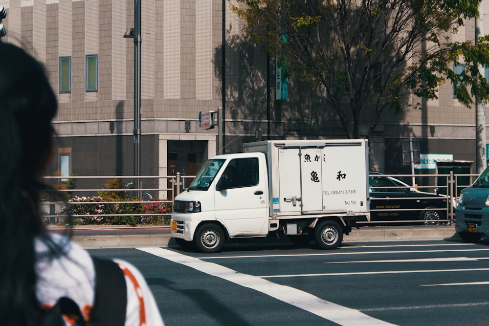 white box truck running on the road