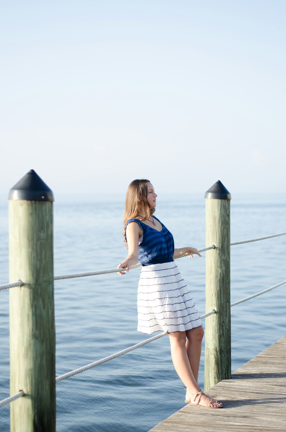 woman leaning on railing