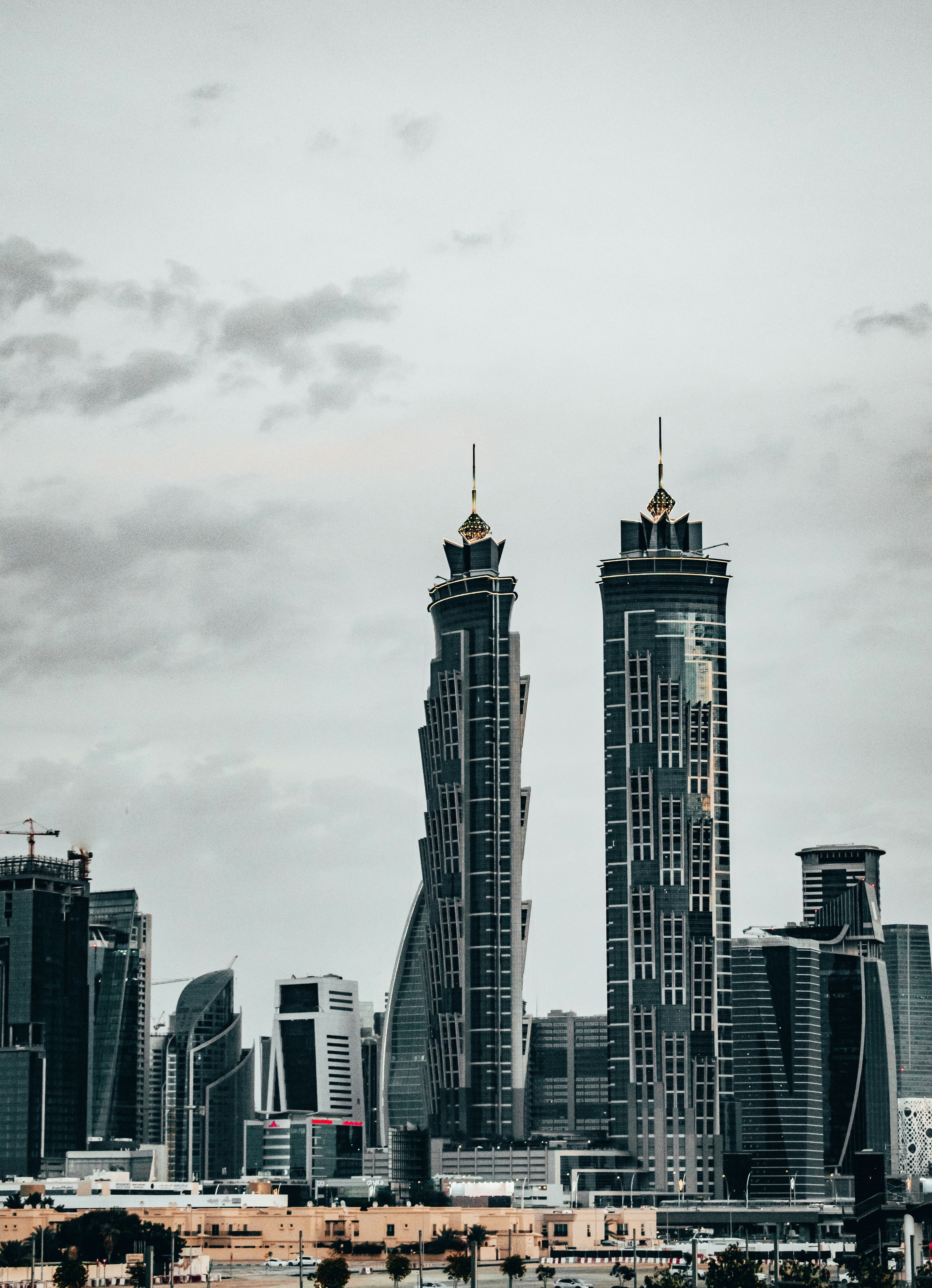 Golden hour Dubai skyline with JW Marriott Marquis Hotel Dubai  viewed from Dubai Canal in Business bay on Tolerance Bridge