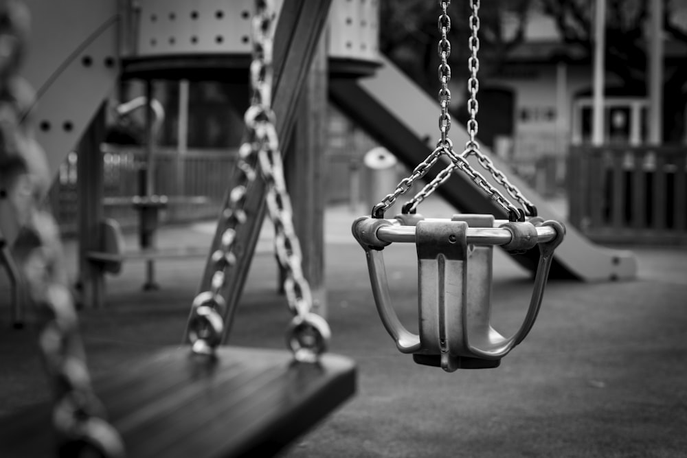 grayscale photo of swing seat