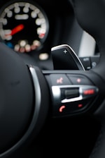 Close-up of a car dashboard showing sport mode activated