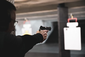 man shooting handgun during wear and carry training