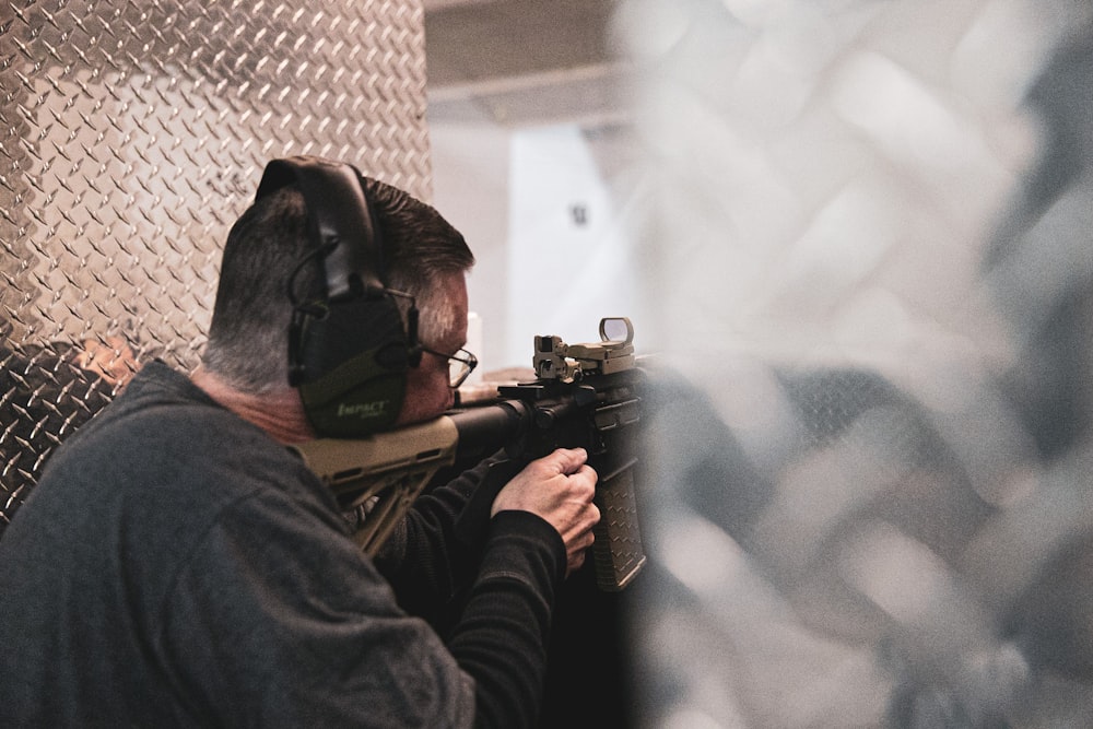 close-up photography of man doing shooting