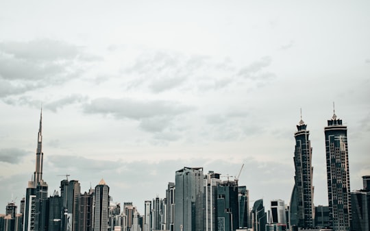city with high-rise buildings under white and gray sky in Business Bay - Dubai - United Arab Emirates United Arab Emirates