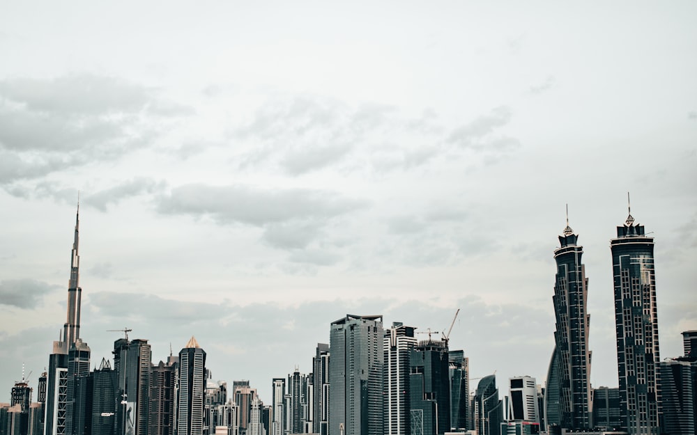 city with high-rise buildings under white and gray sky