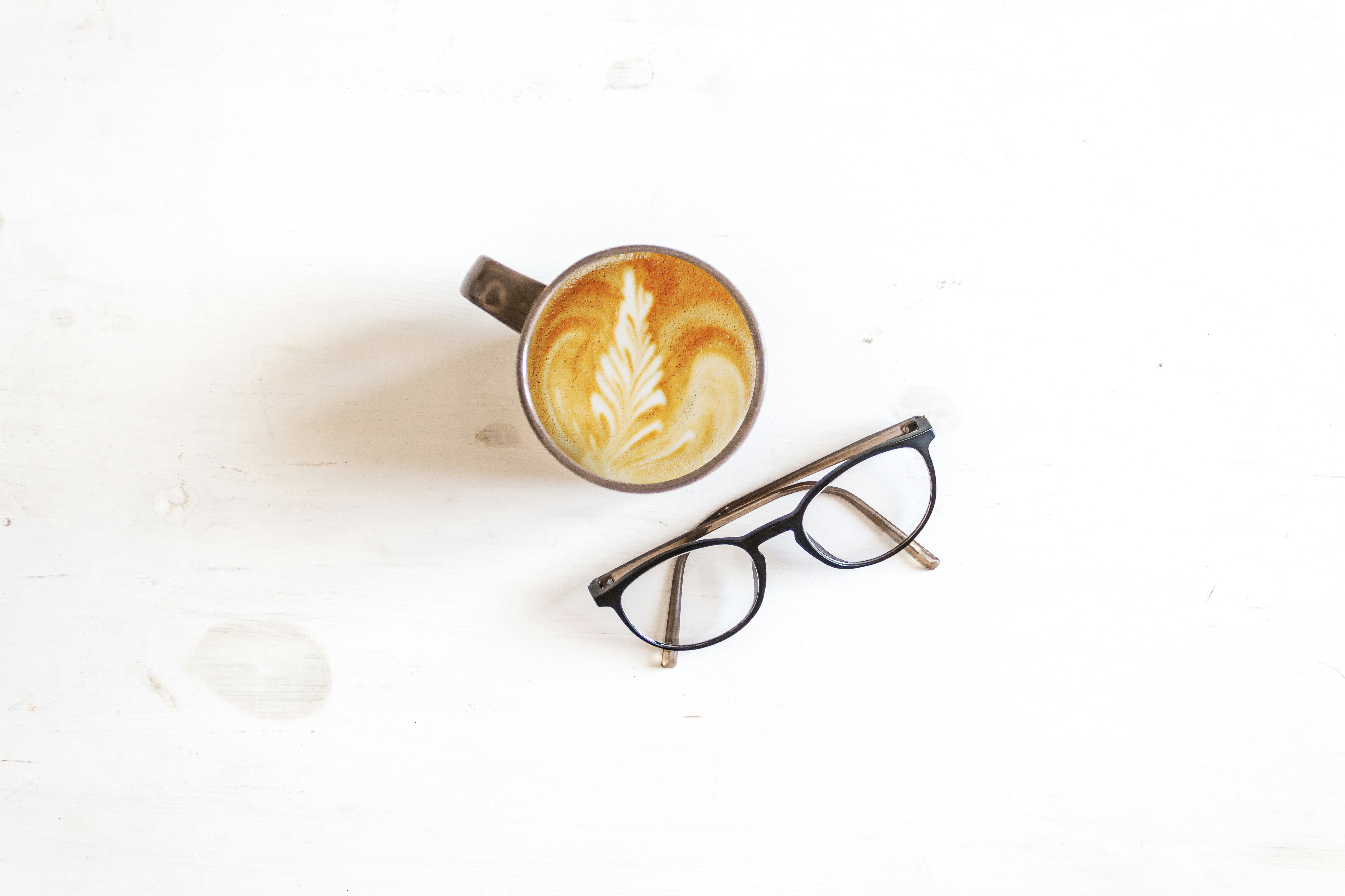 cappuccino near black framed eyeglasses