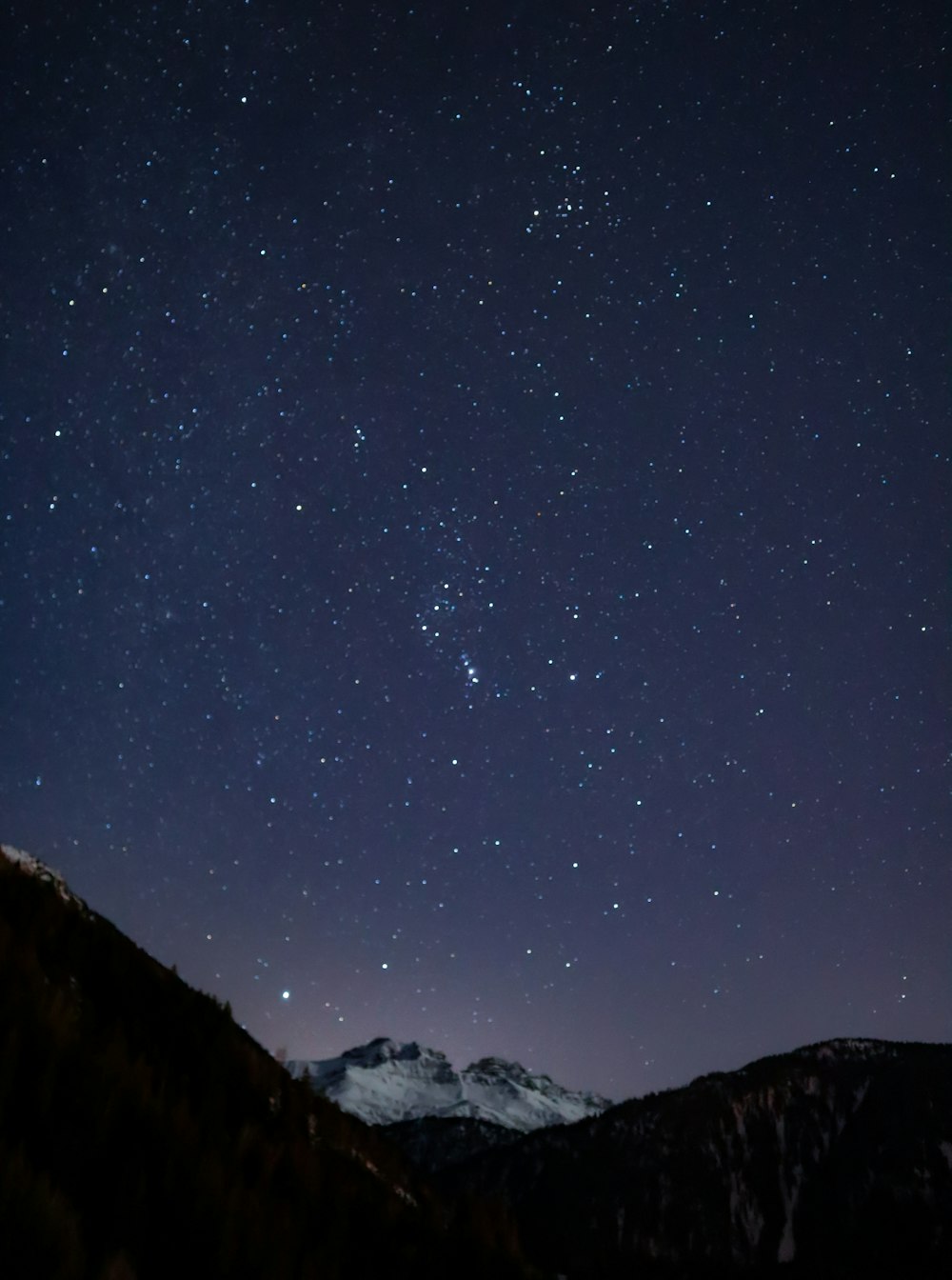 mountain viewing sky during night time