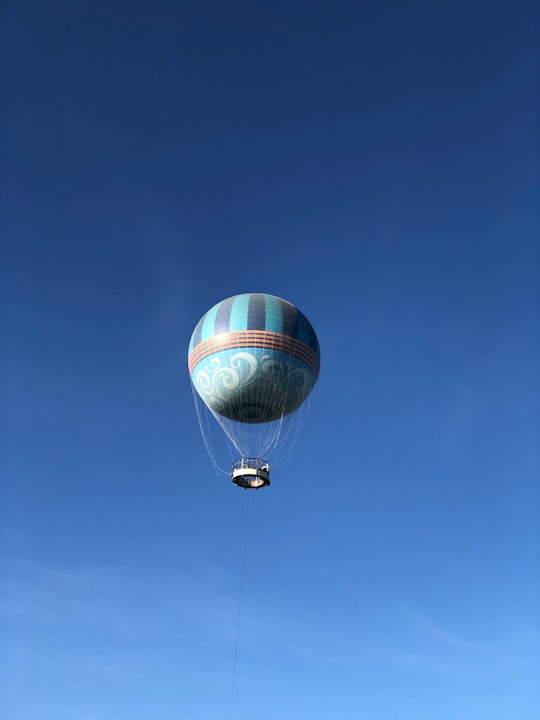 flying gray hot air balloon during daytime in Disney Springs United States