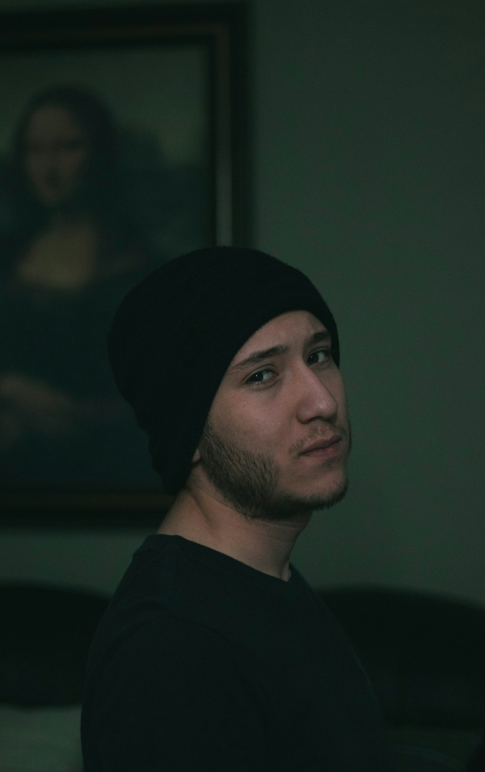 selective focus photography of man wearing black knit cap