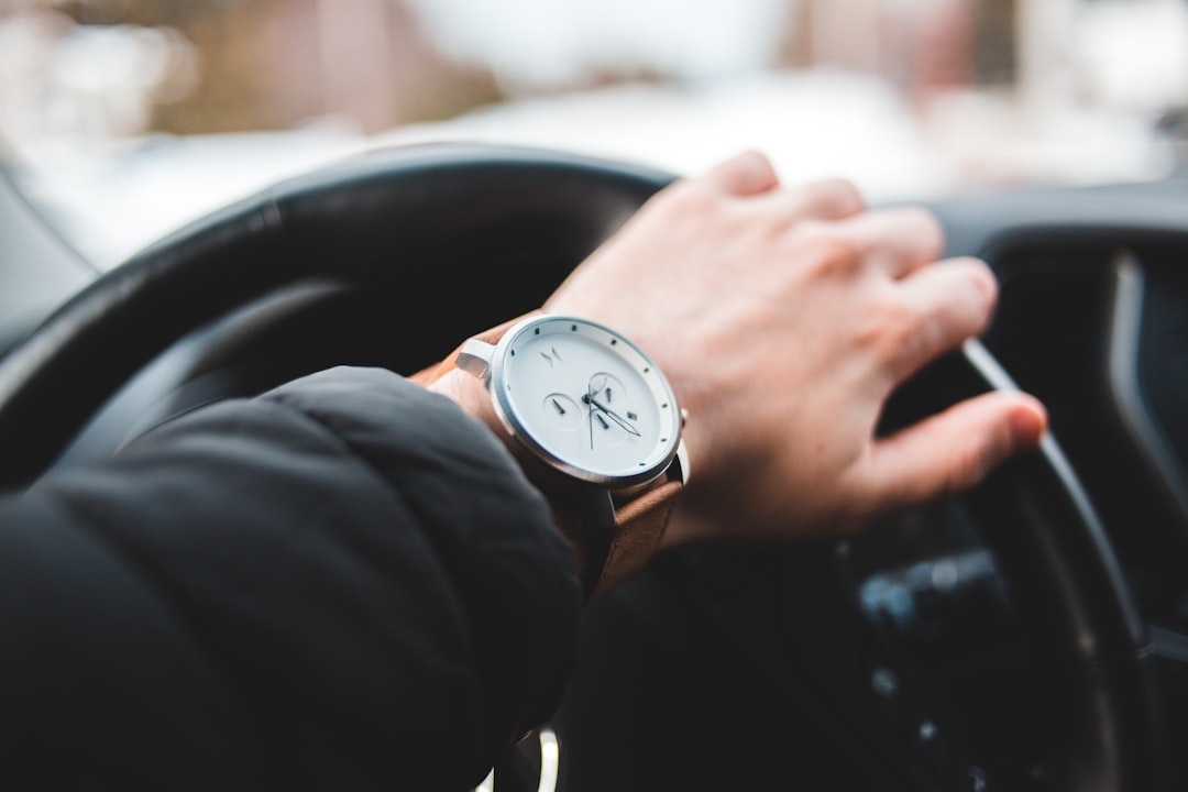 round silver-colored analog watch