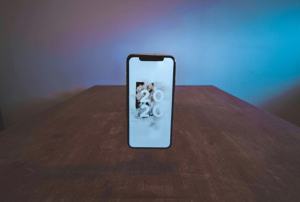 smartphone showing 2020 wallpaper