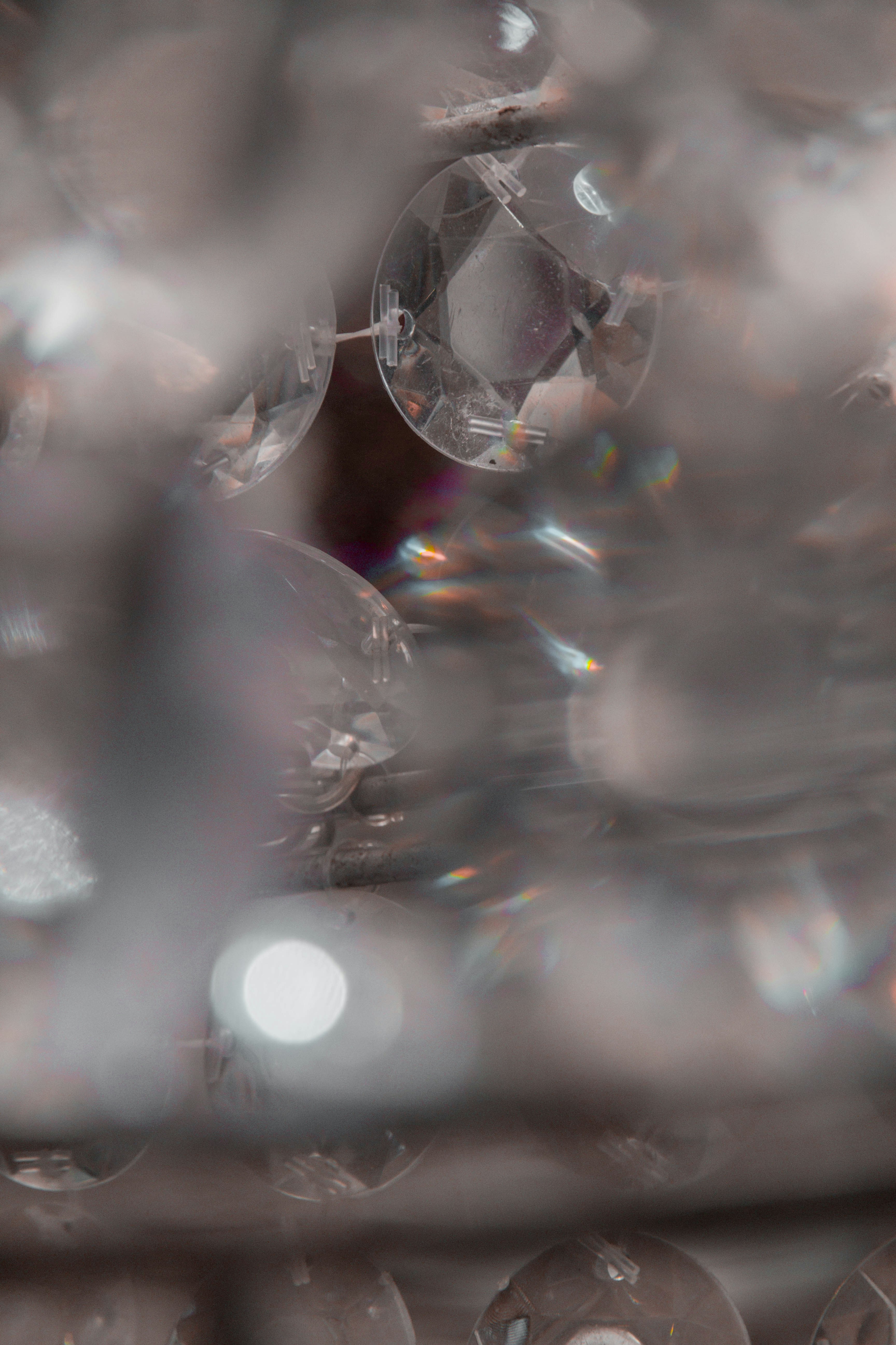 Crystal palace floating above clouds with rainbow light refractions and fantasy architecture
