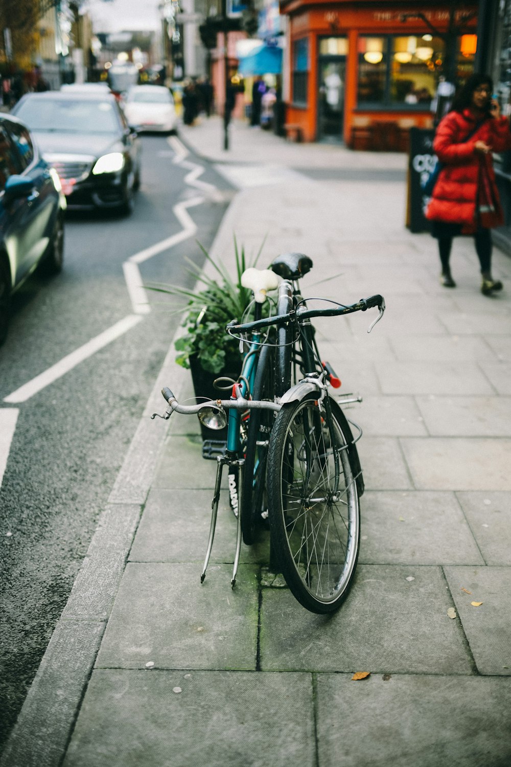 black bike on sidewalk