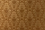 A vintage-style wallpaper with an intricate, repeating floral and damask pattern in shades of brown and beige. The design features ornate, symmetrical motifs that create a sense of elegance and classic decor.