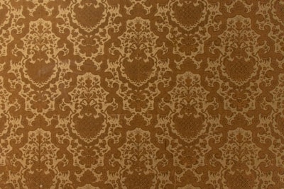 Elegant vintage-style wallpaper applied in a classic dining room.
