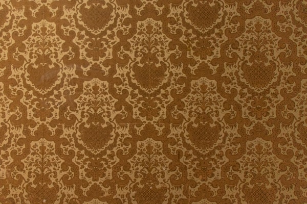 Elegant black floral wallpaper with intricate patterns enhancing a stylish dining room.