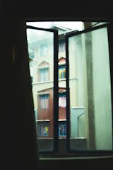 Window view from triple room overlooking the peaceful neighborhood around Madhav PG.