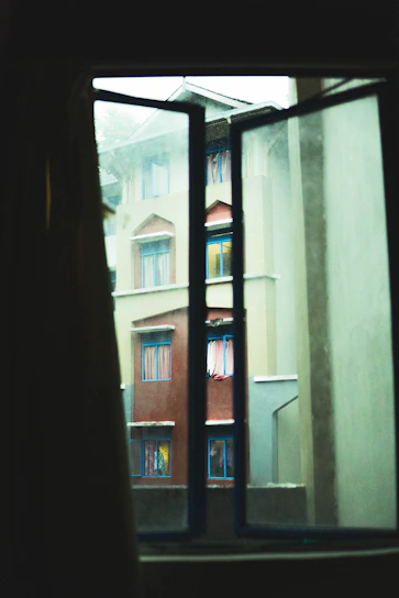 View from deluxe room window overlooking a quiet street in Ahmedabad.