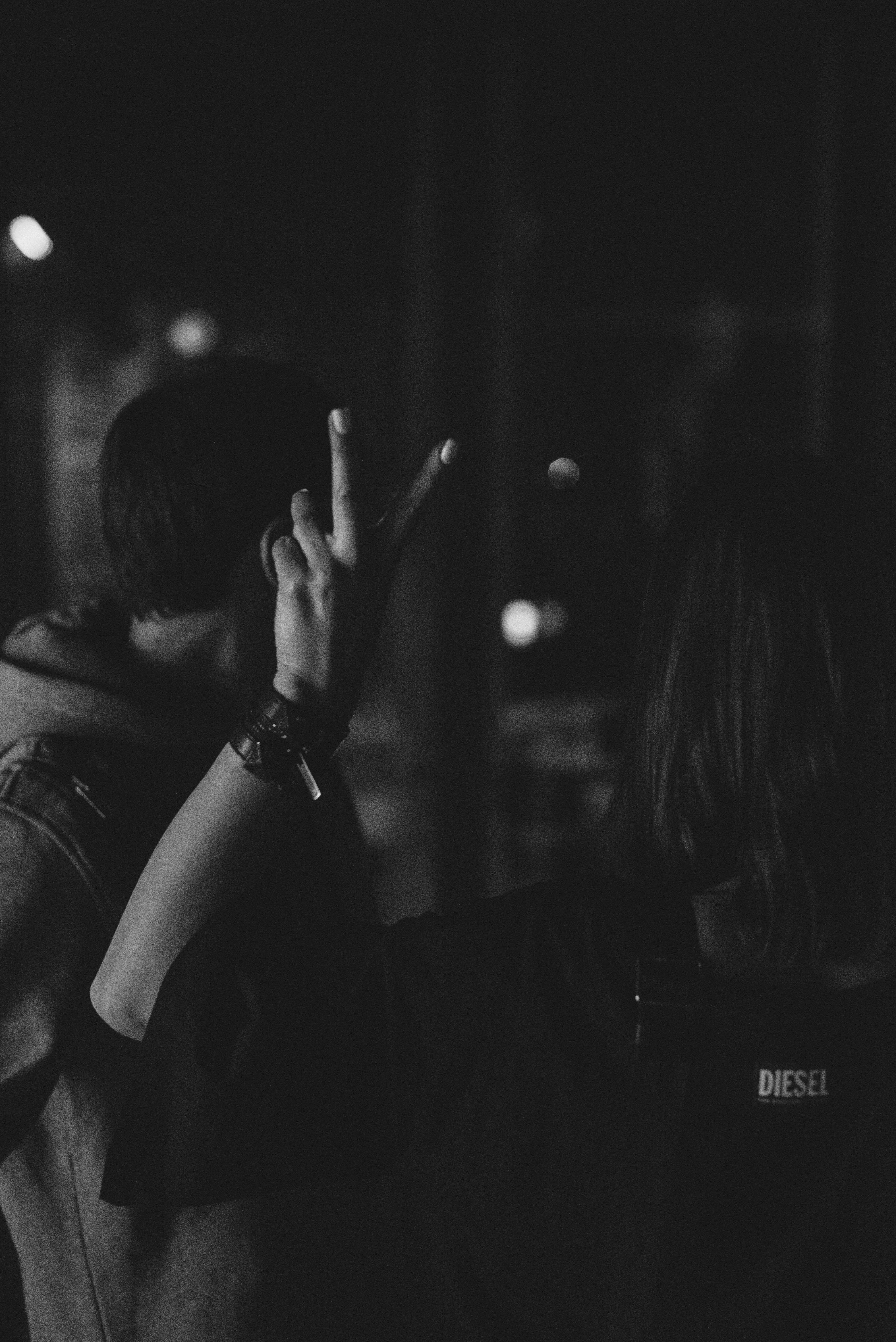 Grayscale photography of unknown person raising left hand photo – Free ...