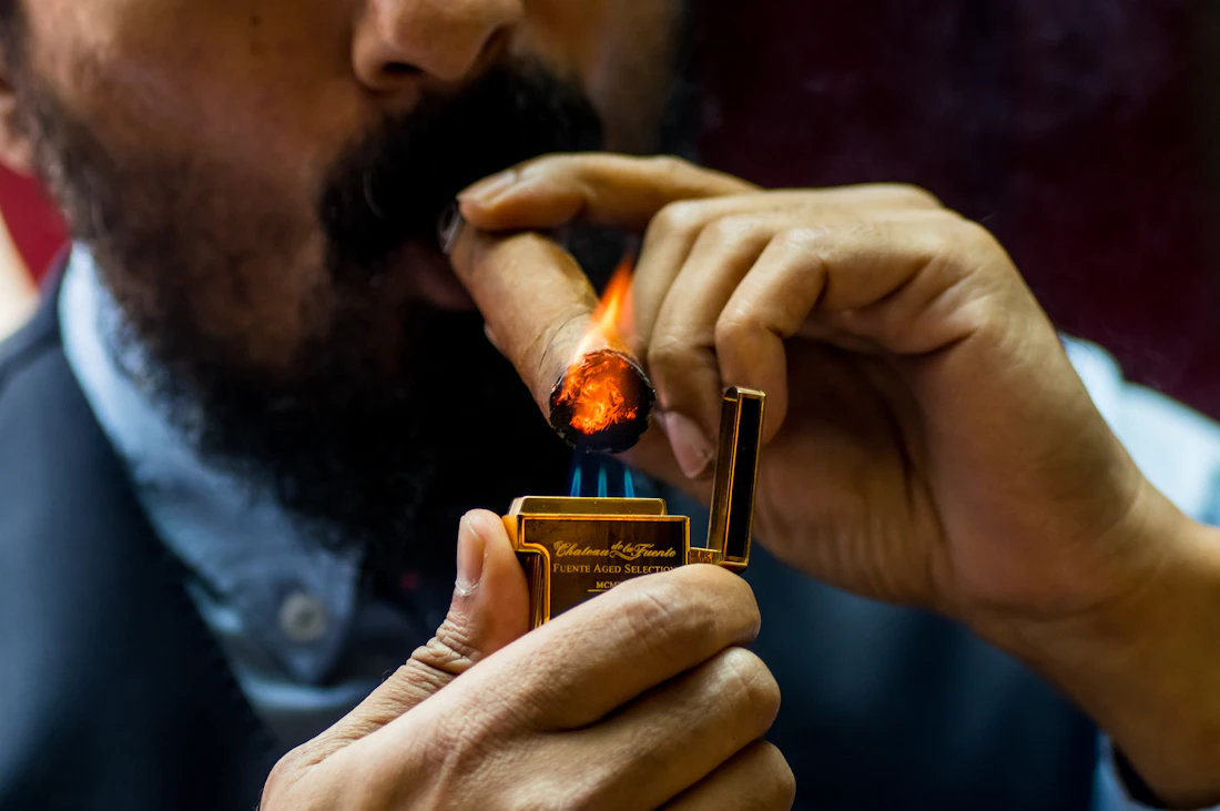 Lighting a cigar at an event