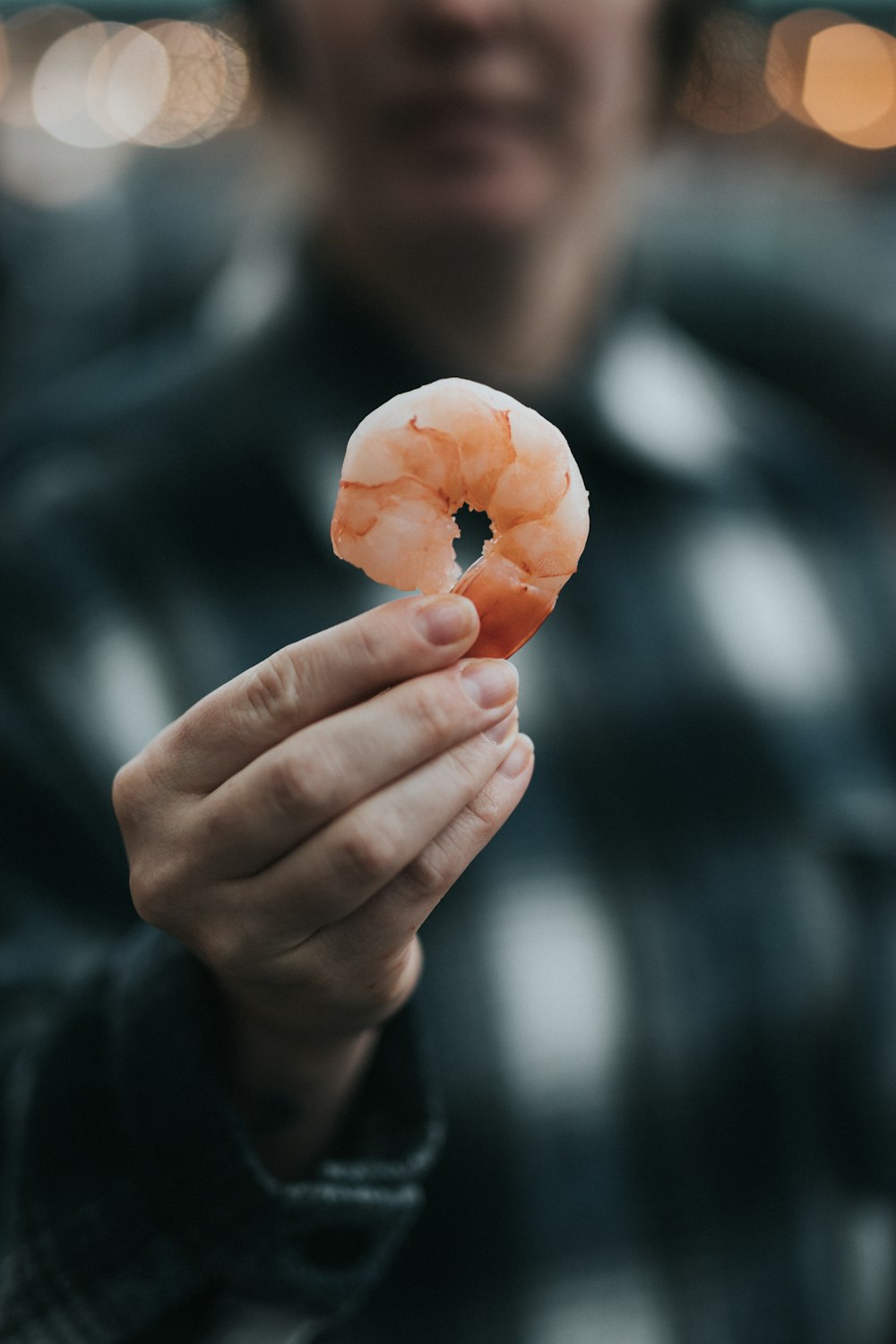 person holding a shrimp