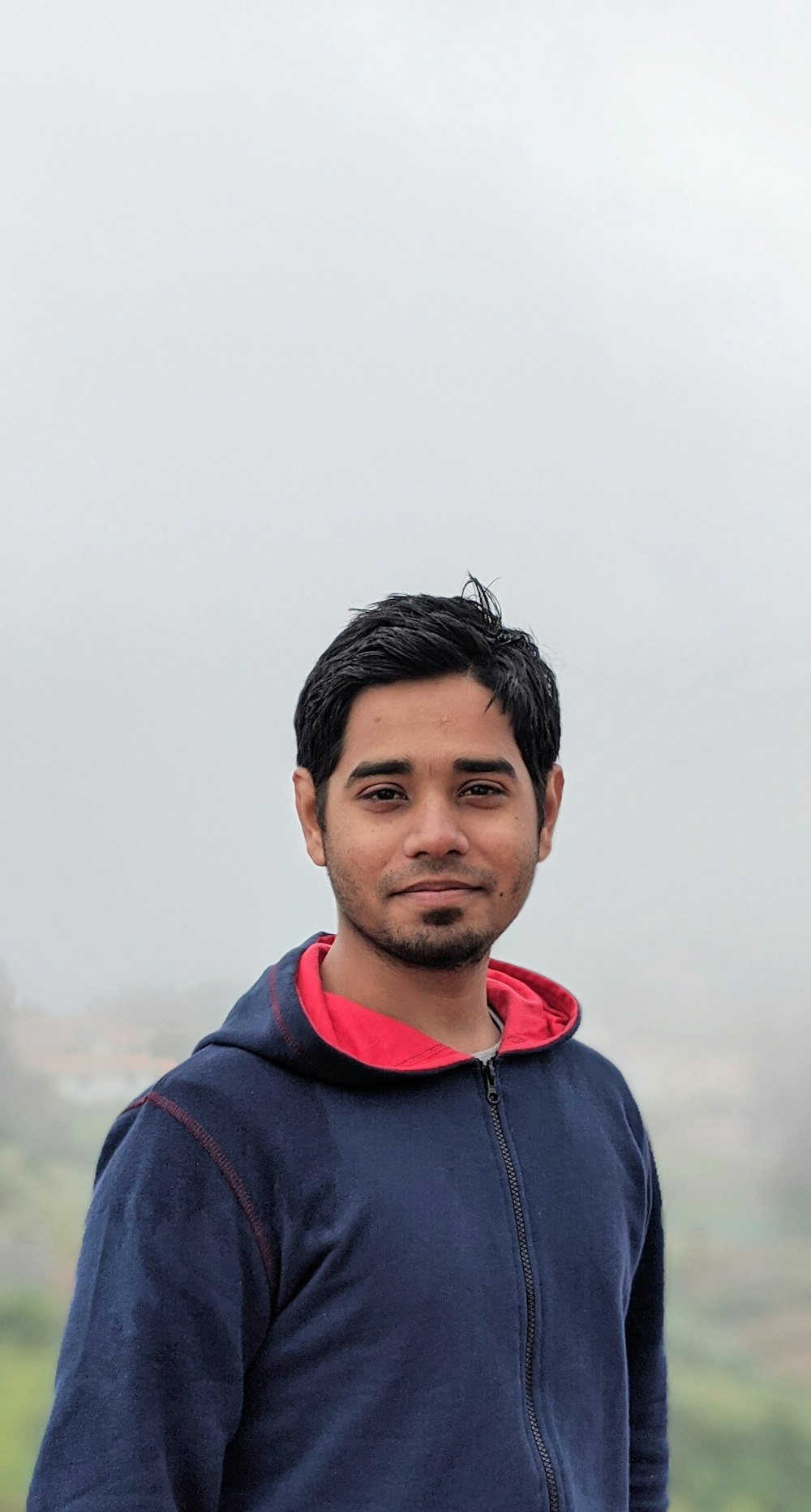 man wearing blue hooded jacket