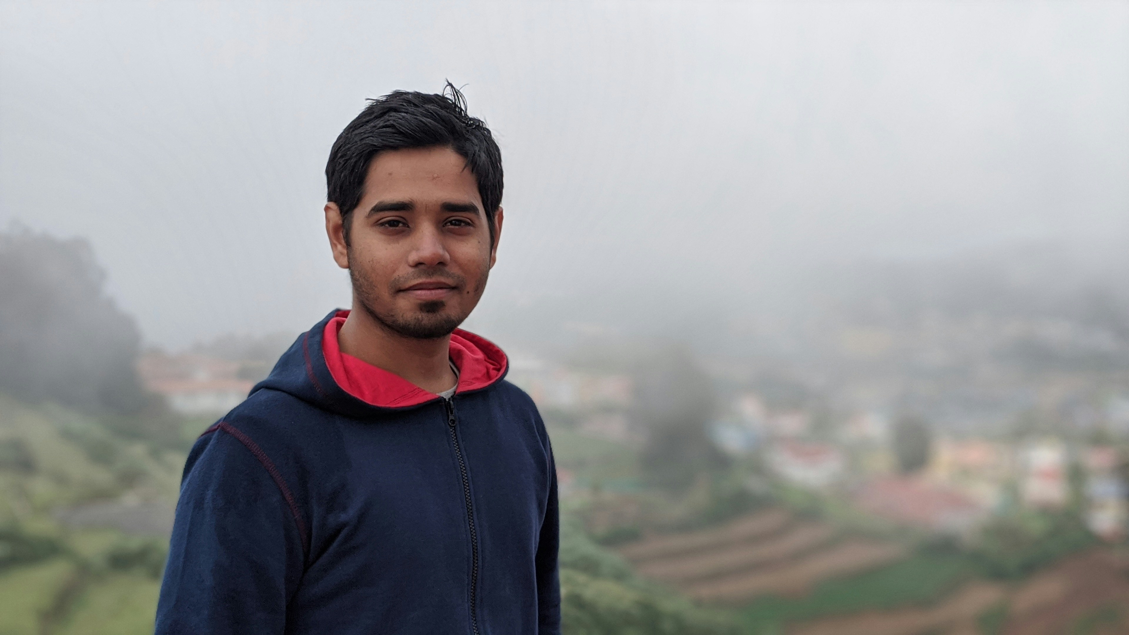 Winter season look of a handsome Indian man. Shot on Pixel 2XL. Landscape shot with rule of third.