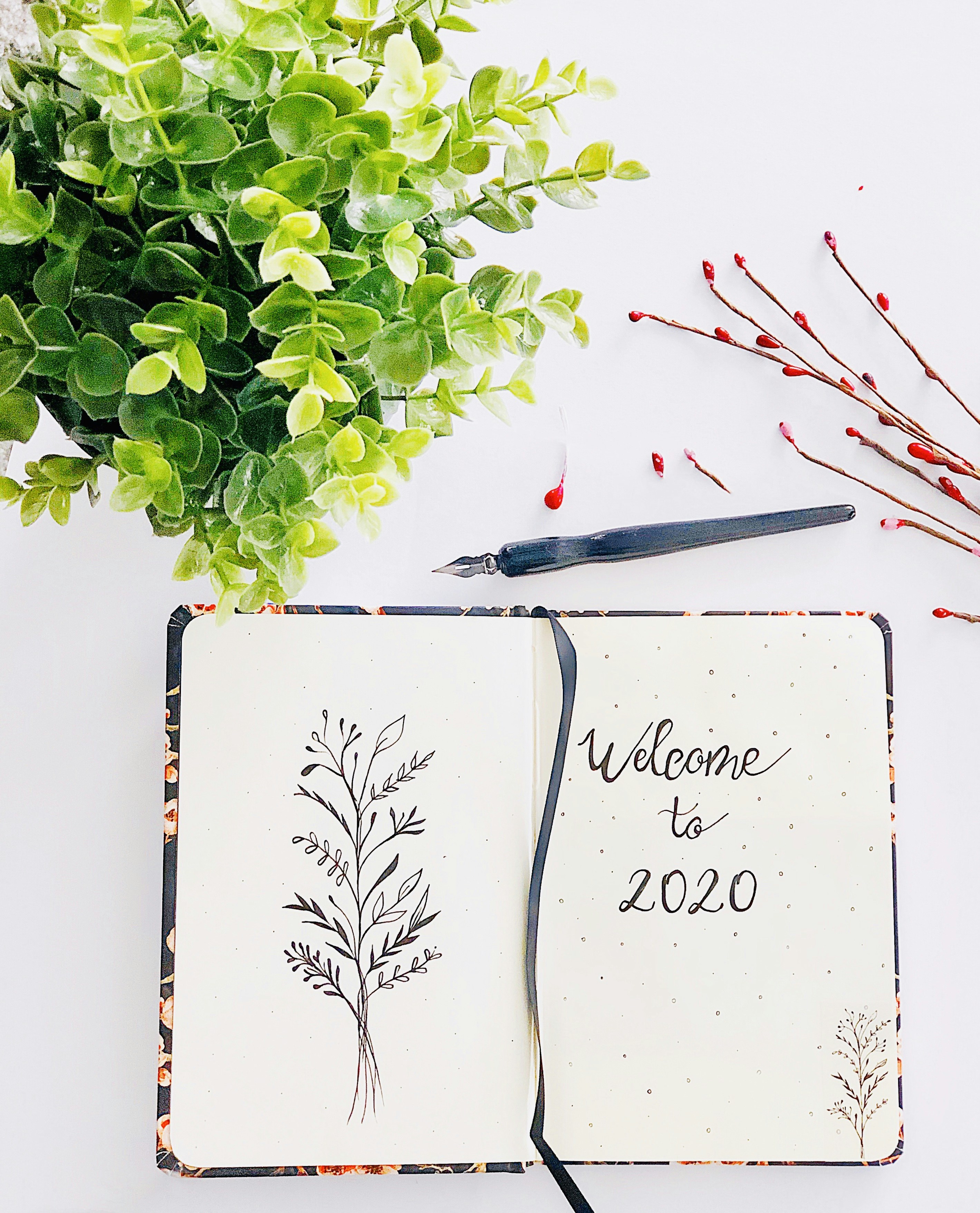 A notebook with a welcome to 2020 written on it photo – Free Plant ...