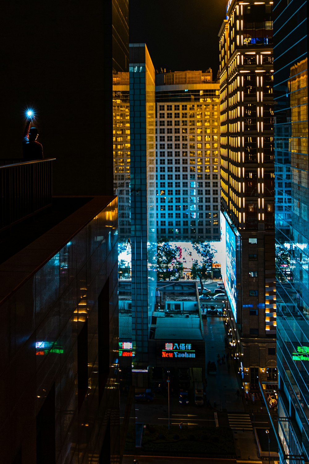 a view of a city at night from the top of a building