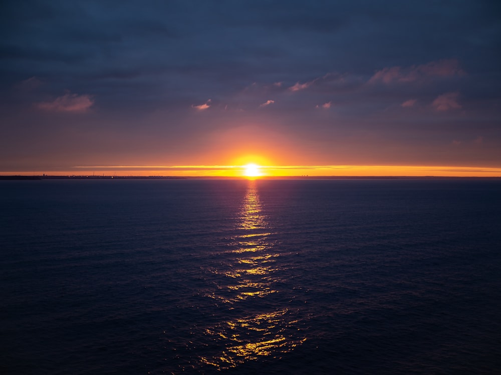 body of water during sunrise