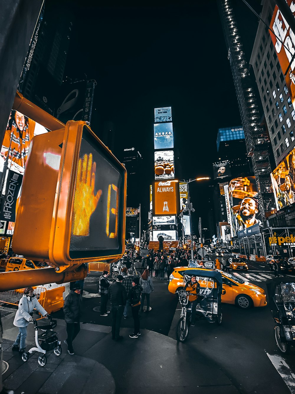 people crossing road at night