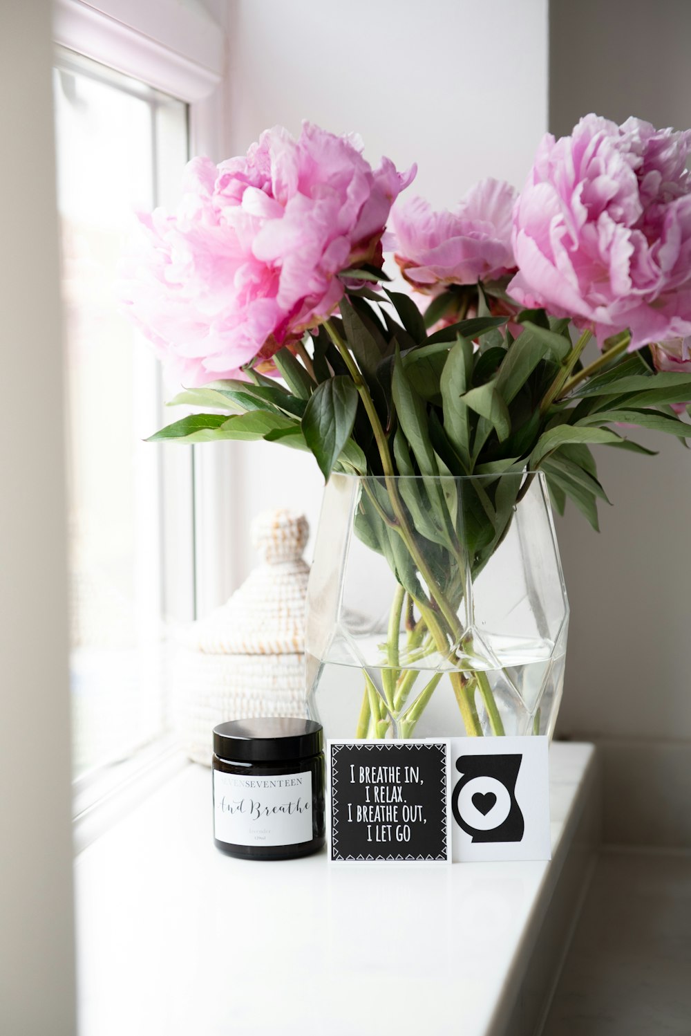 bouquet of pink-petaled flowers in a vase