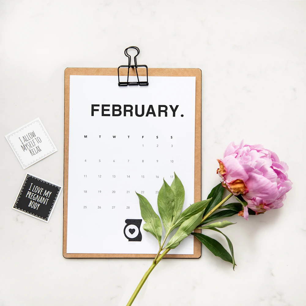 Wedding day marked on a calendar with a flower beside it
