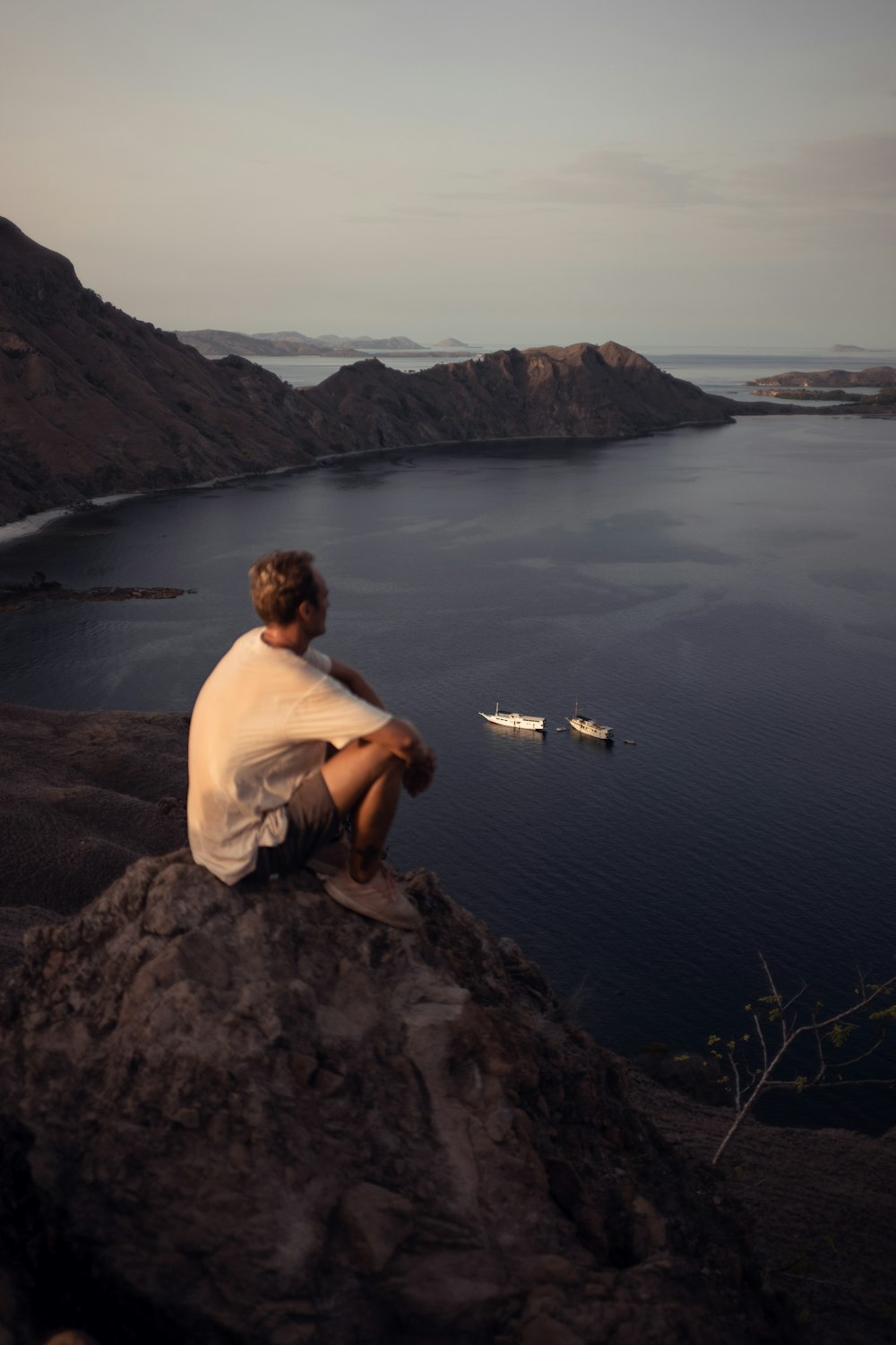 man sitting on cliff