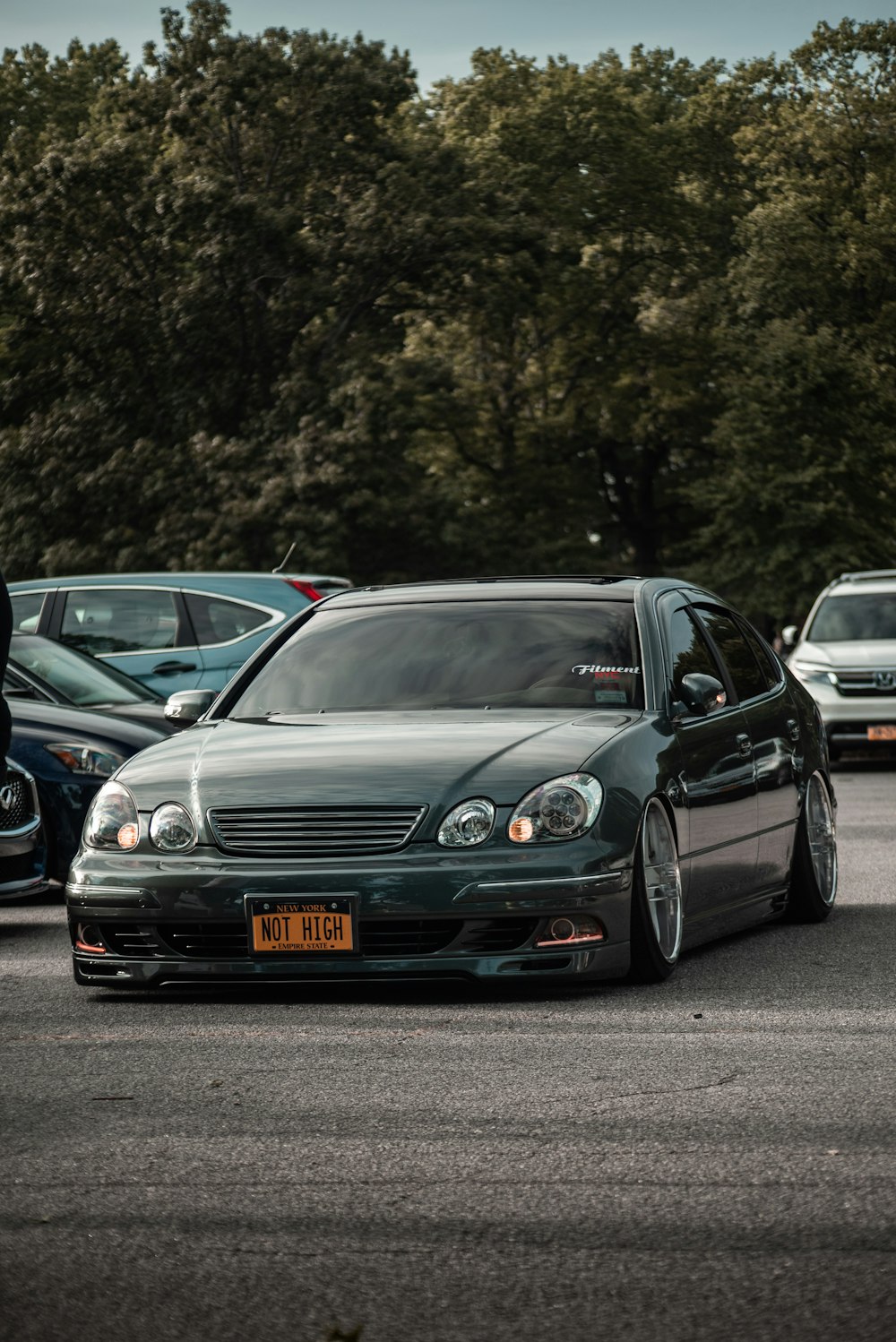 black lowered sedan on the road