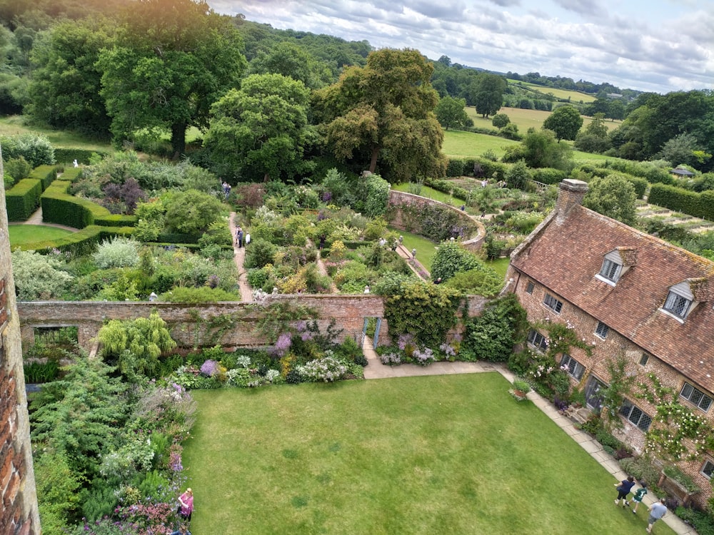 aerial photography of brown house and green-leaved trees