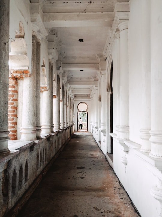 person standing on pathway in Kellie's Castle Malaysia