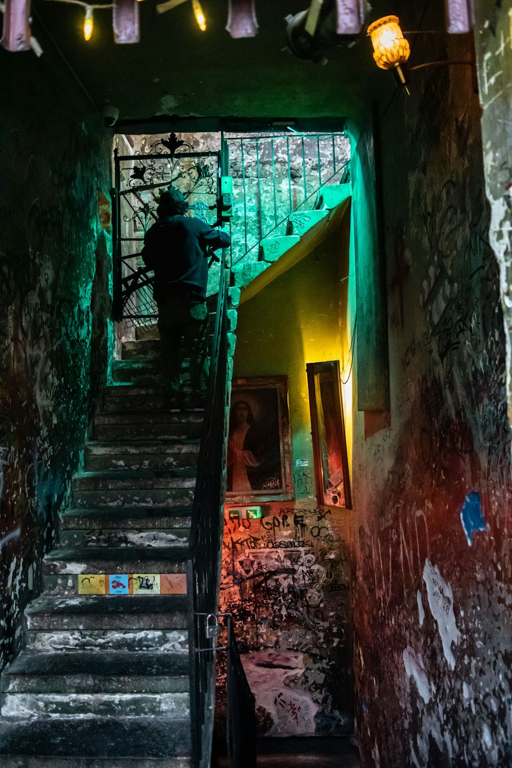 person at the staircase inside building