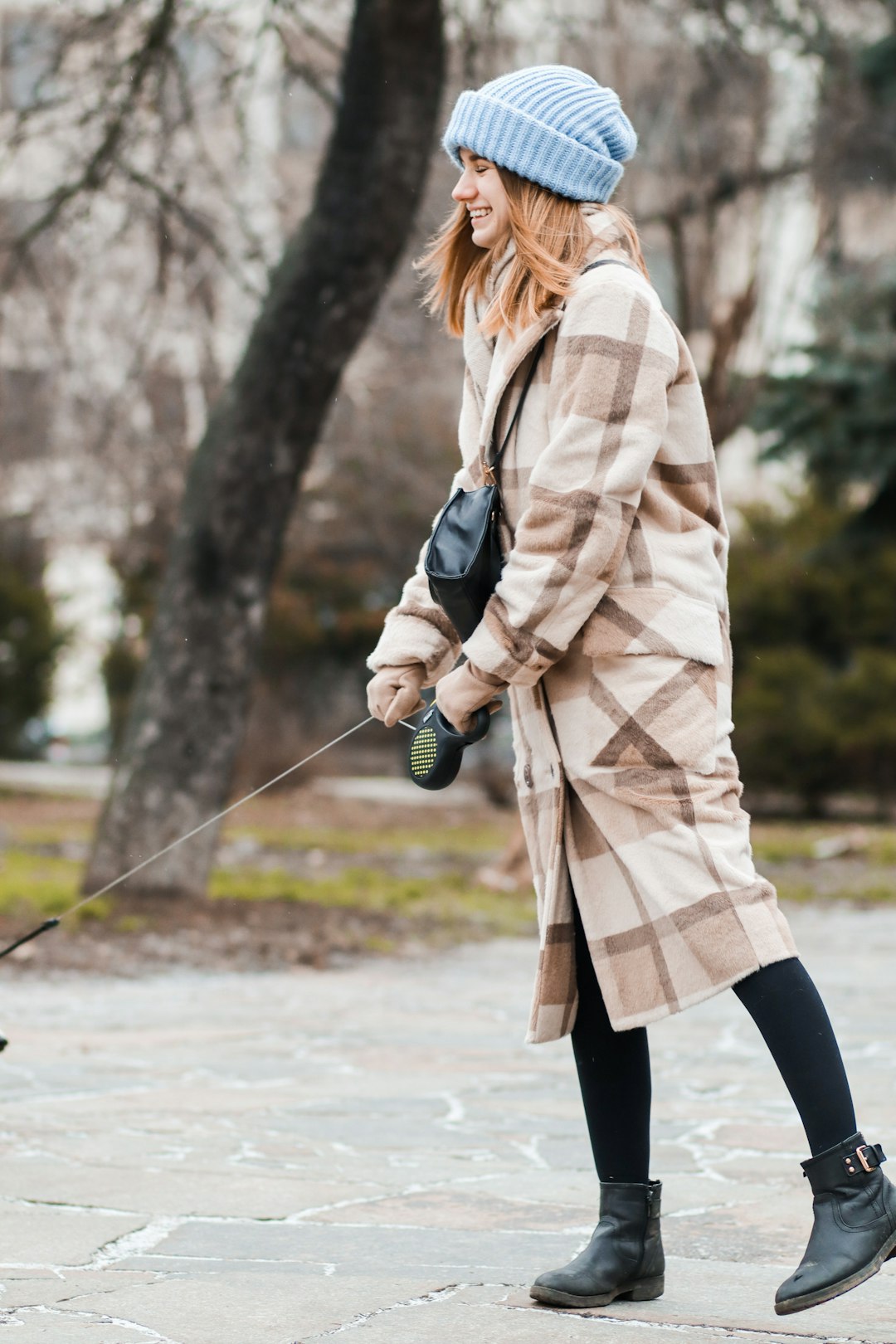 woman holding pet leash