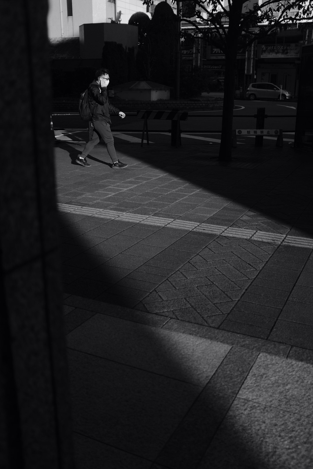 man walking near trees