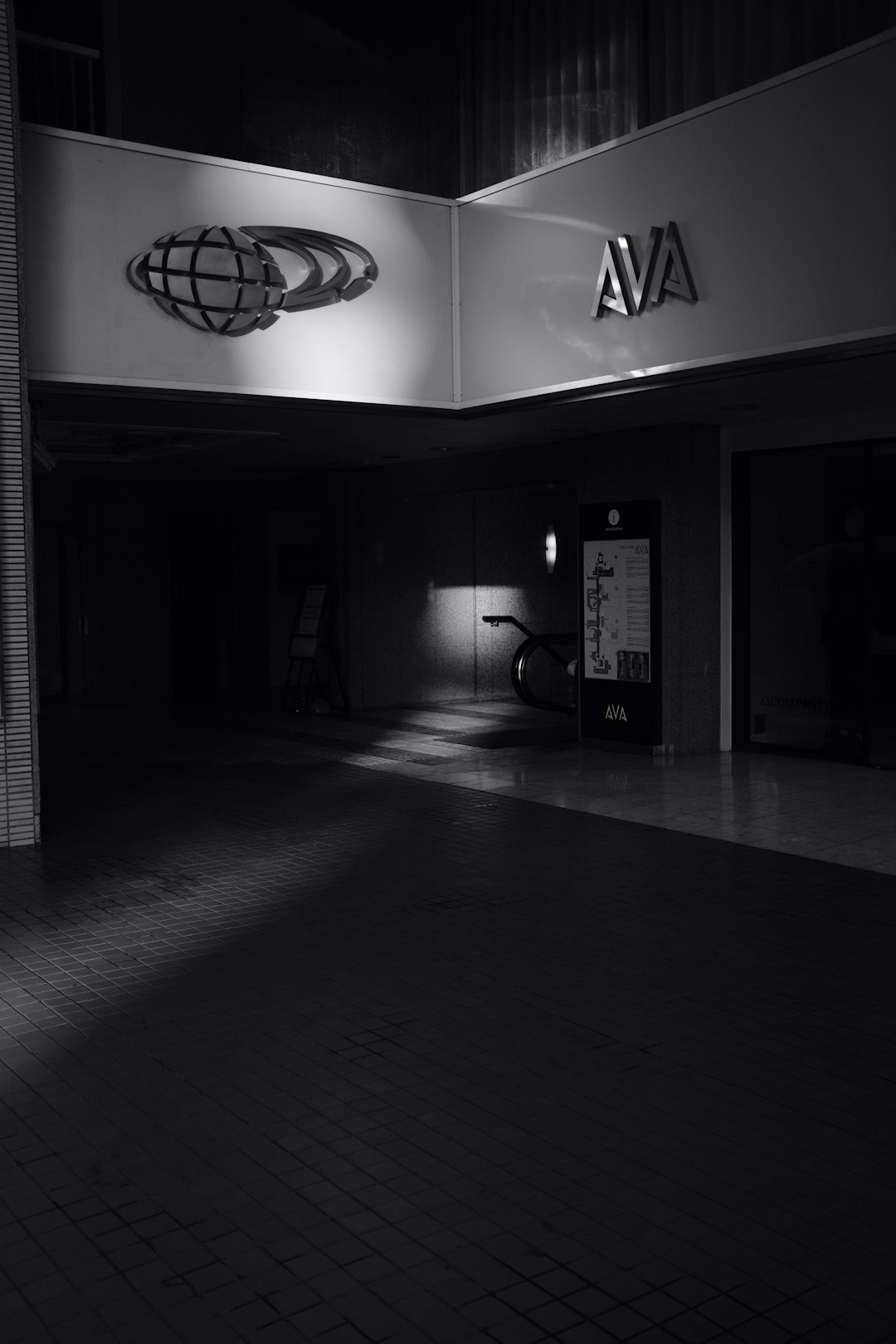 grayscale photography of AVA building front