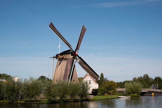 brown windmill in Delft Netherlands