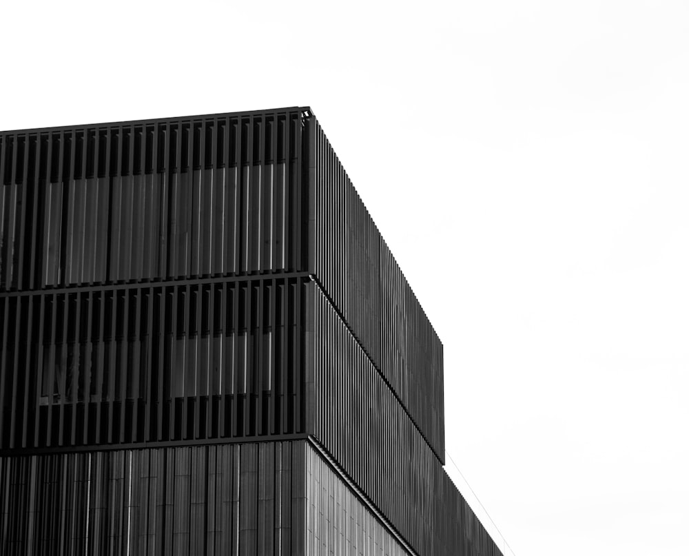 low-angle grayscale photography of a high-rise building