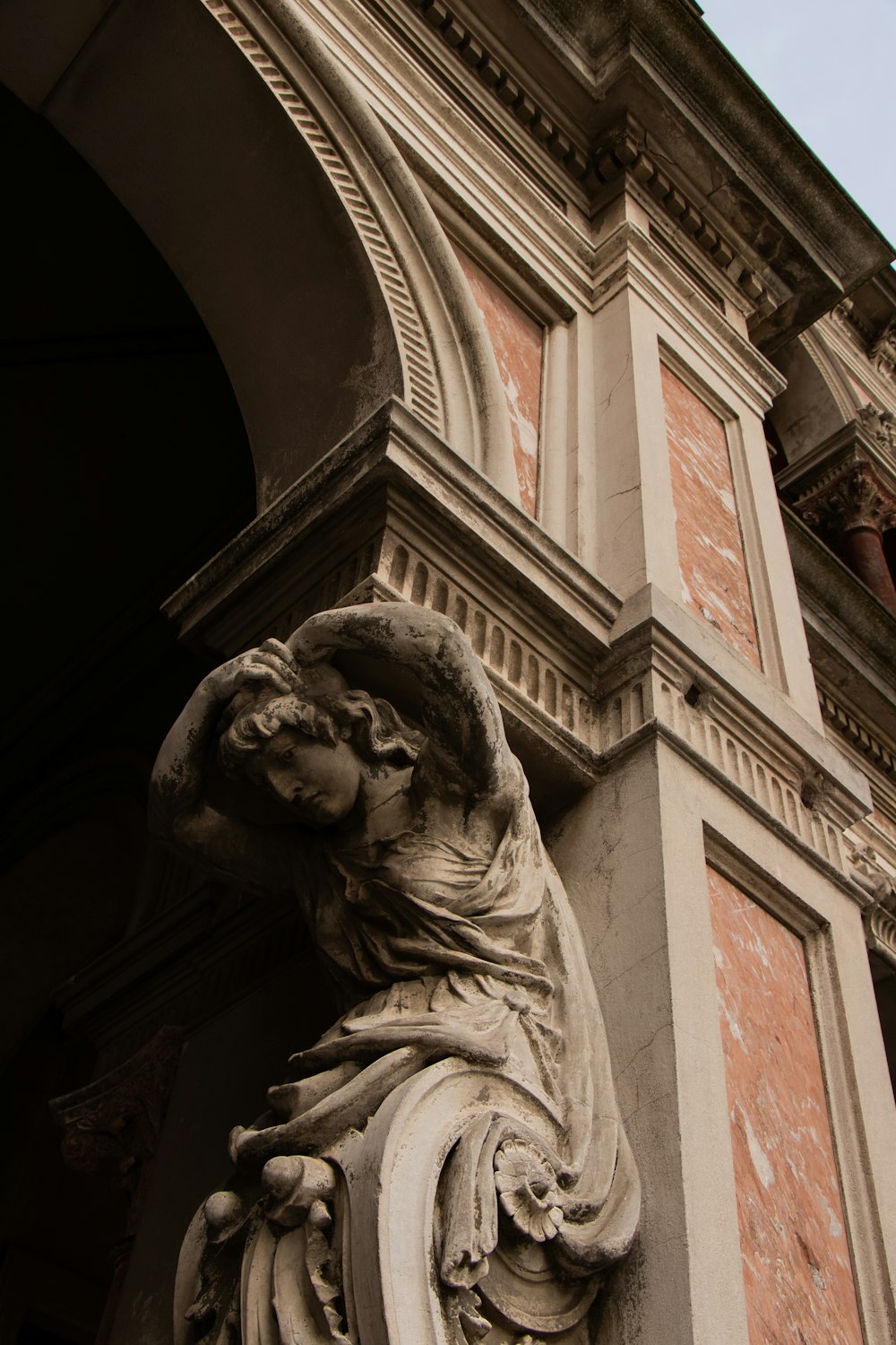 low-angle photography of a statue of a woman