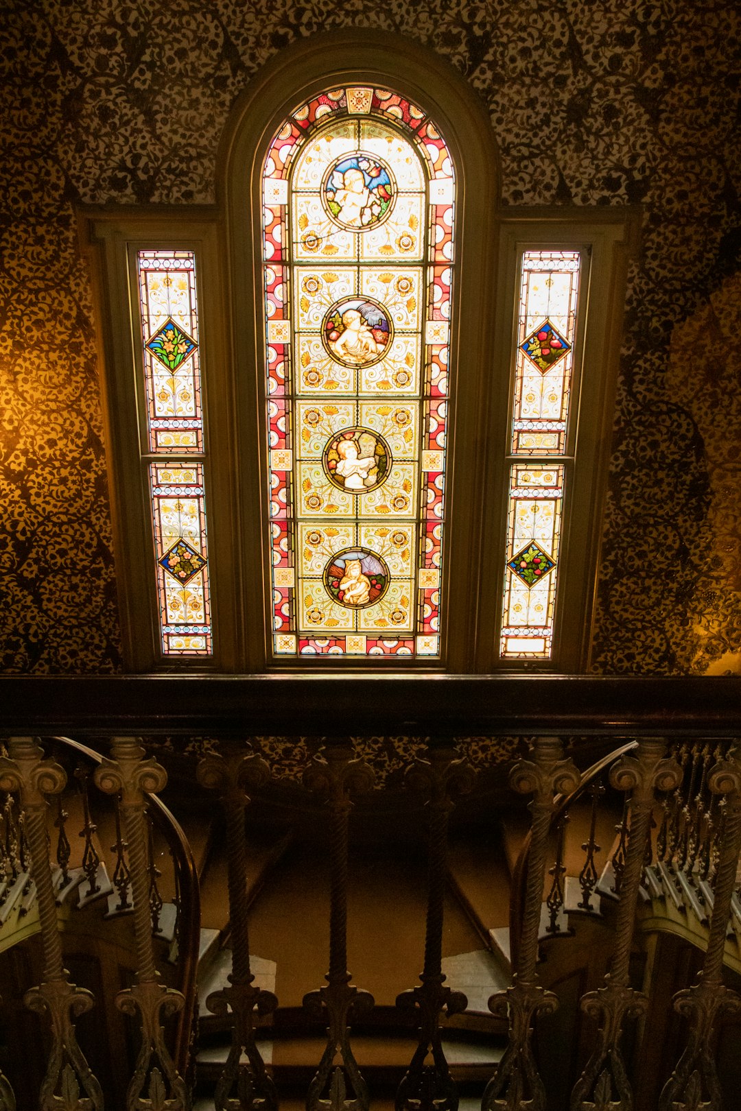 white, red, and beige stained glass window