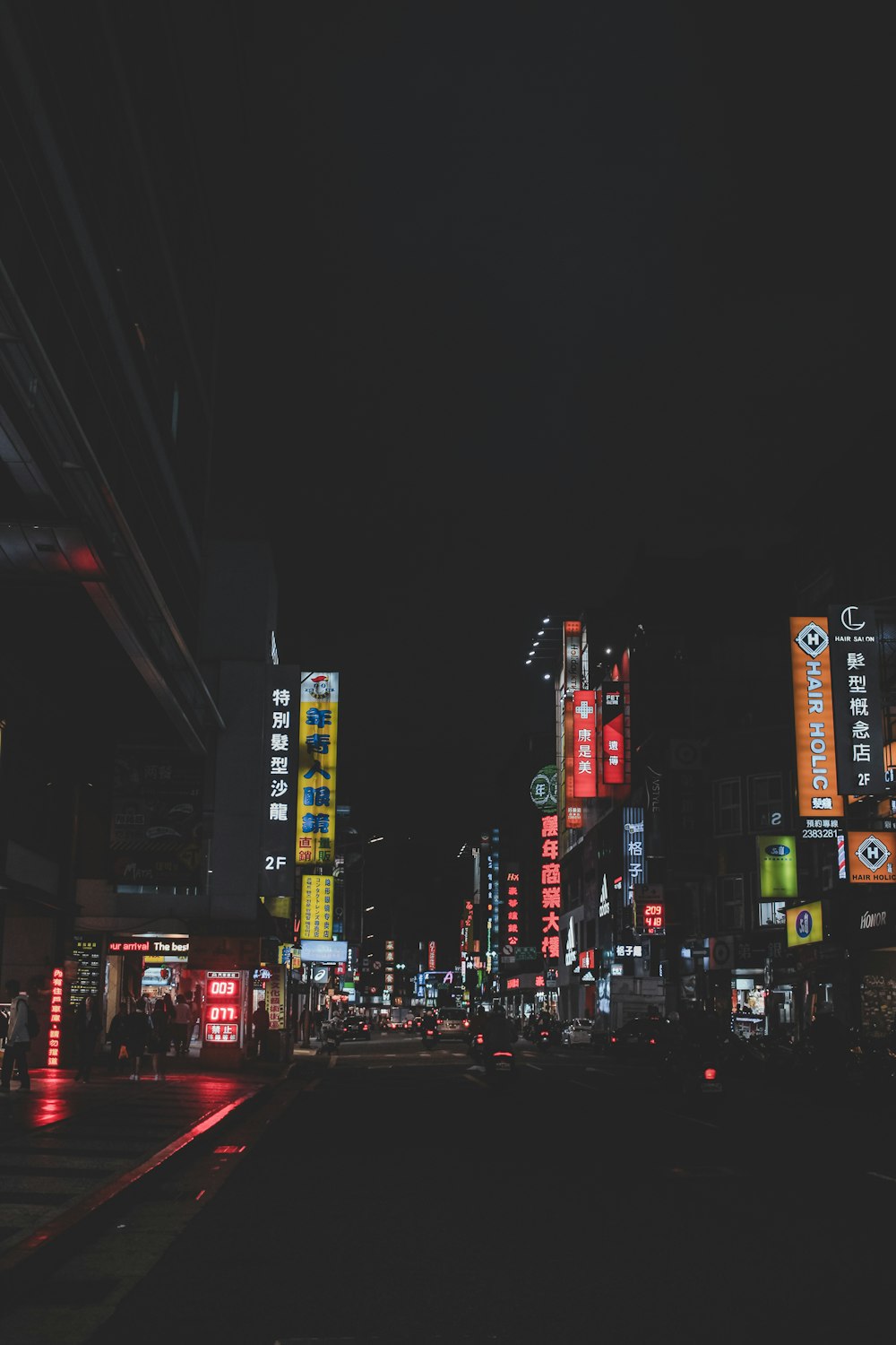 lighted street buildings during night time